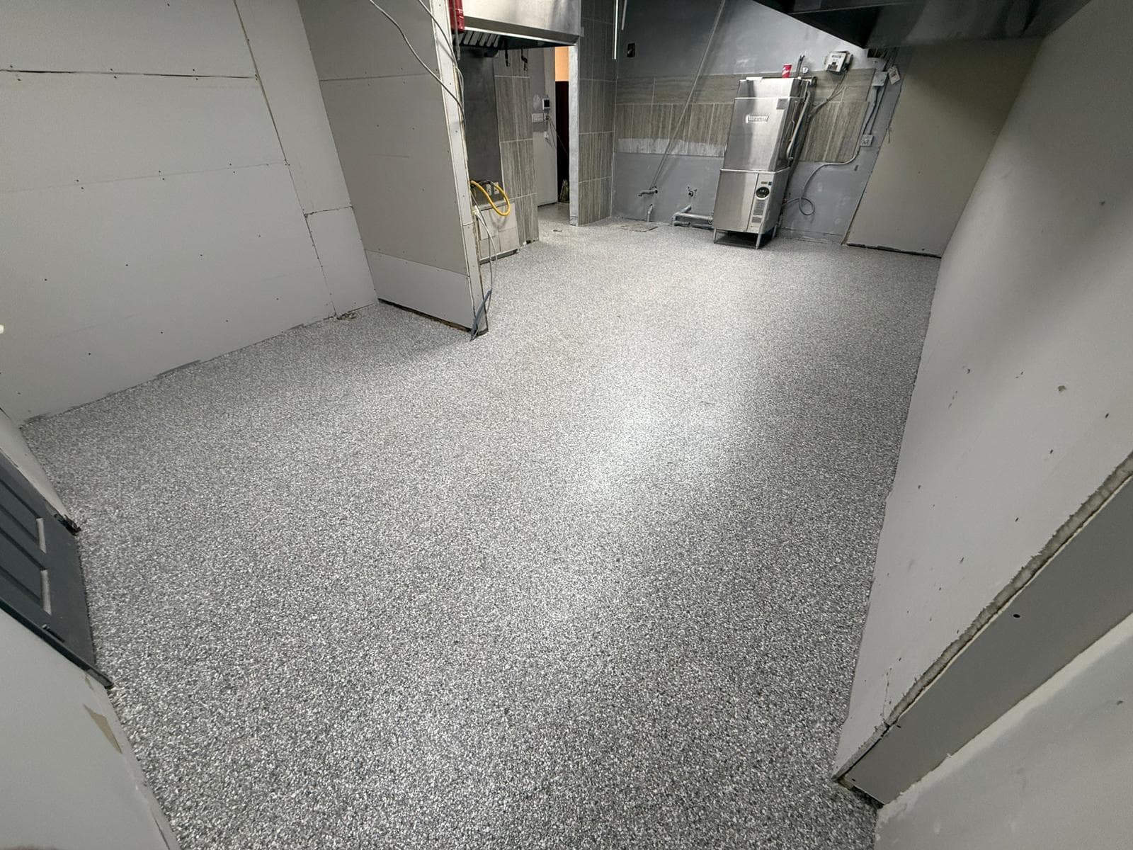 Professional epoxy flooring installation by Titan Seal Epoxy in Pickering - stunning high-rise balcony with flake epoxy coating overlooking GTA